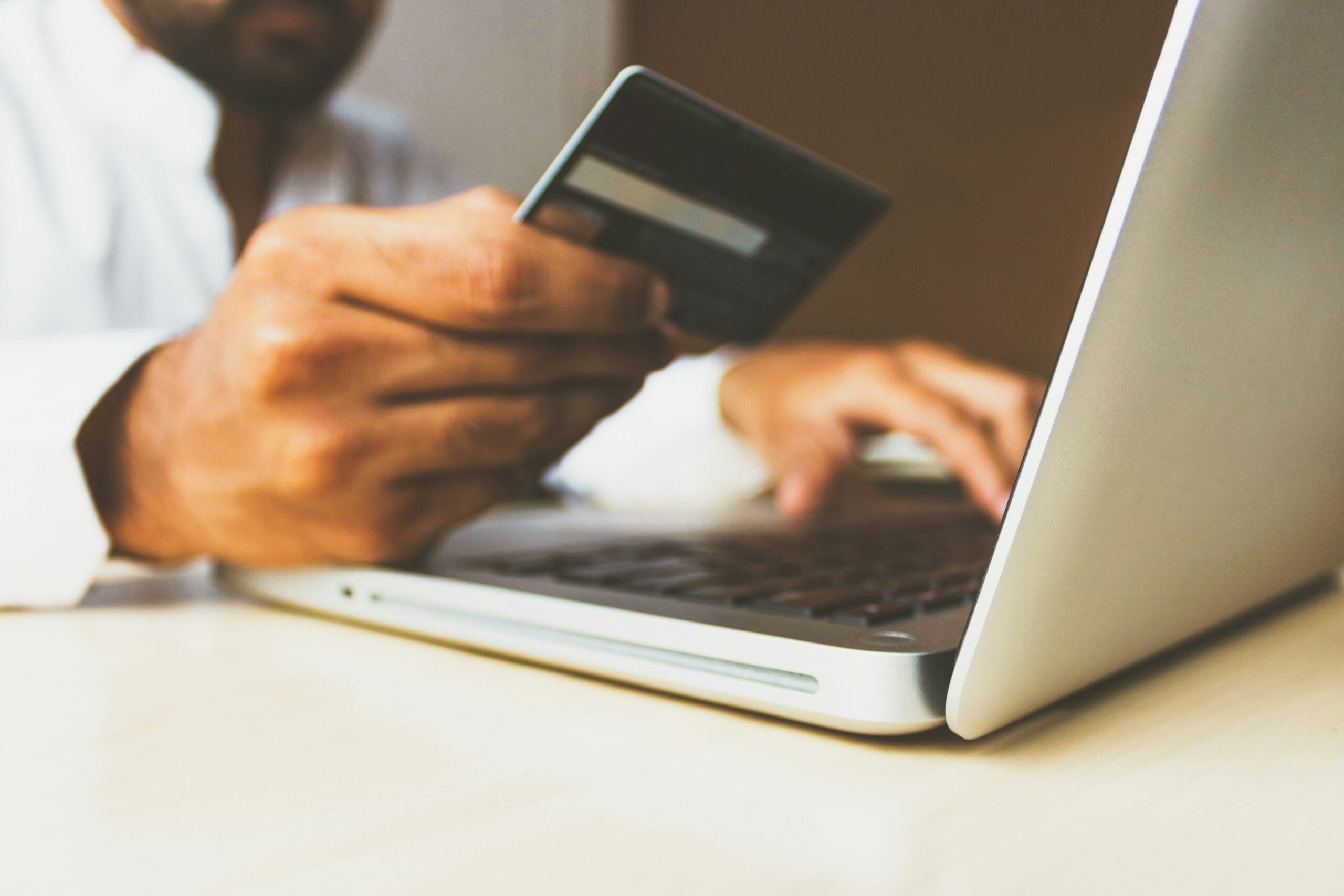 The Role of Professional Electronics Engineers in Retail: A Focus on the Philippine Convenience Store and Small Business Sector 1 person using laptop computer holding card